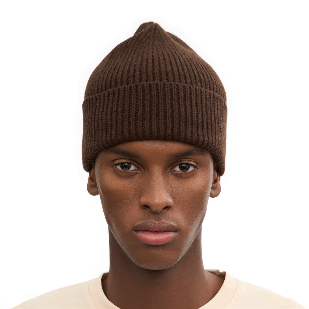 Colorful Standard Merino Wool Beanie Coffee Brown – worn by a male model, front view