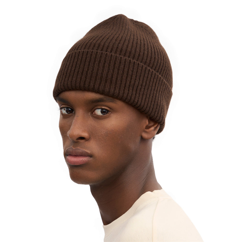 Colorful Standard Merino Wool Beanie Coffee Brown – worn by a male model, three-quarter view