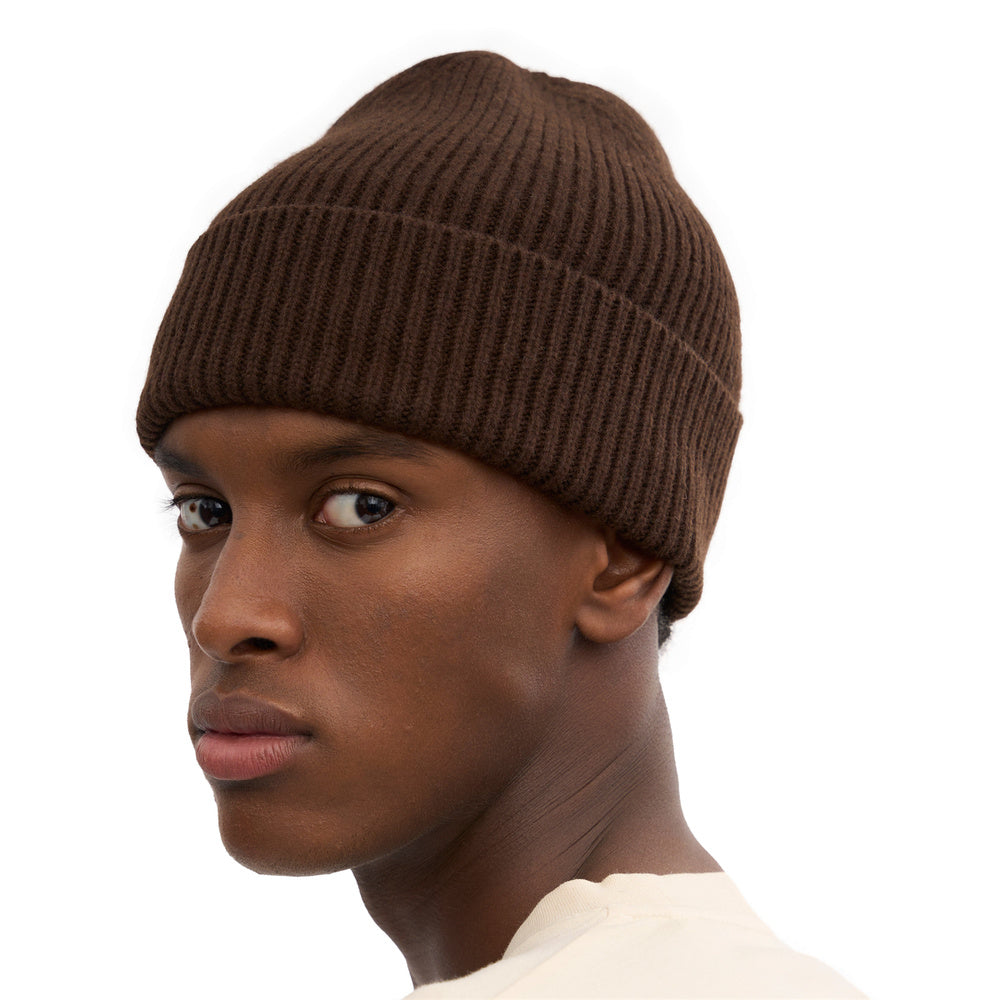 Colorful Standard Merino Wool Beanie Coffee Brown – worn by a male model, close-up