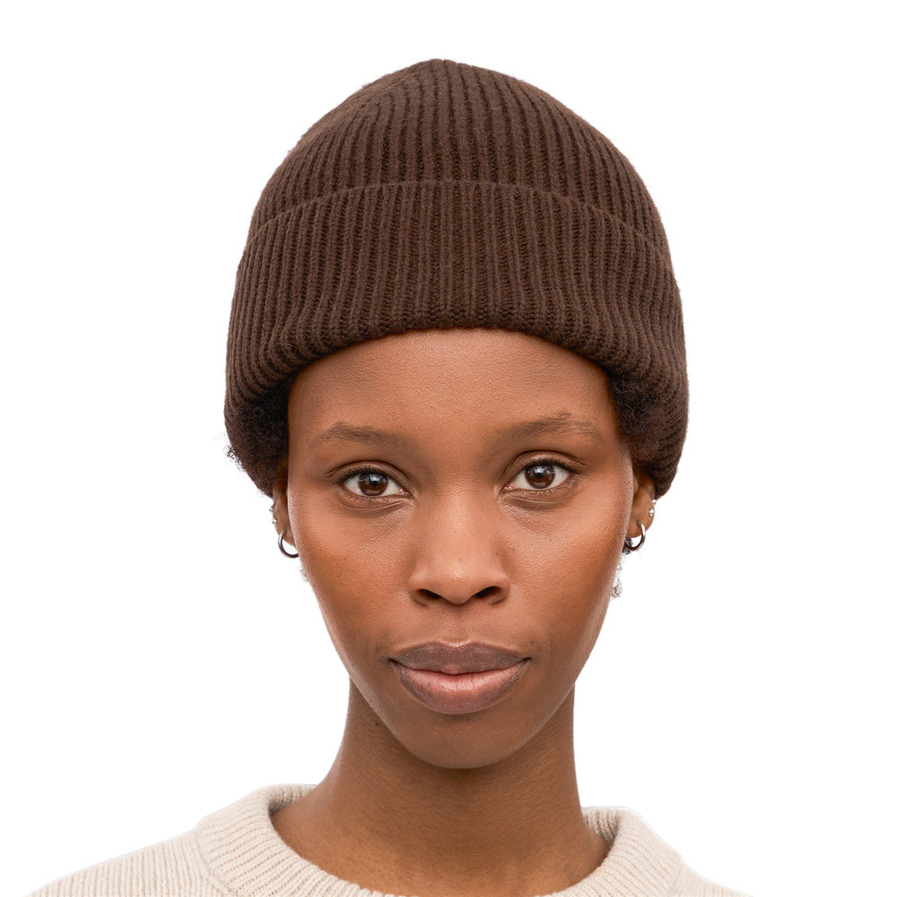 Colorful Standard Merino Wool Beanie Coffee Brown – worn by a female model, front view