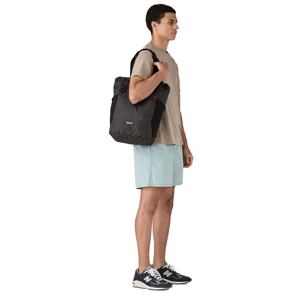Patagonia Terravia Tote Pack 24L Black – carried as a backpack, side view